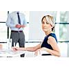 Businesswoman sitting and smiling at camera