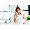 Young attractive businesswoman in office