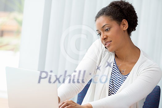 Businesswoman using her mobile in offfice Businesswoman using her mobile in offfice
