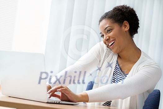 Businesswoman using her mobile in offfice Businesswoman using her mobile in offfice