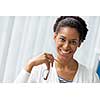 Businesswoman smiling and sitting in offfice