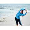 Sporty young woman on the sea coast