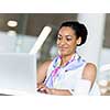 Young business woman working with laptop in office