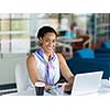 Young business woman working with laptop in office