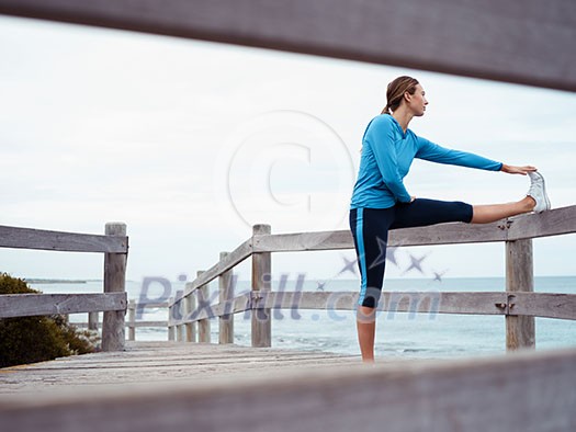 Sporty young woman on the sea coast Sporty young woman on the sea coast