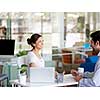 Two collegues working together in an office