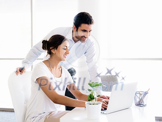 Two collegues working together in an office Two collegues working together in an office