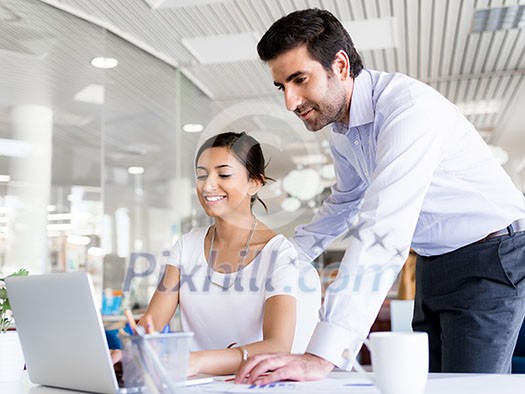 Two collegues working together in an office Two collegues working together in an office