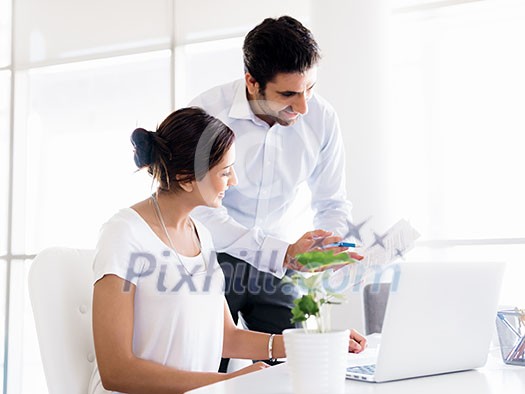 Two collegues working together in an office Two collegues working together in an office