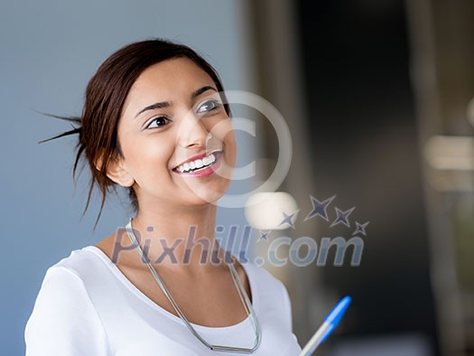 Happy and confident young woman in an office Happy and confident young woman in an office