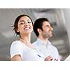 Happy and confident young woman in an office