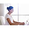 Young woman working with a laptop in office