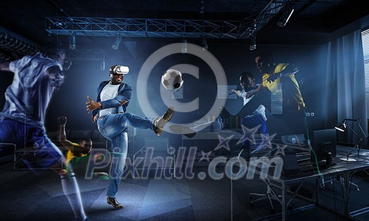 Aframerican man wearing virtual helmet and trying soccer game. Mixed media