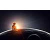 Little girl and big Earth planet. Elements of this image furnished by NASA