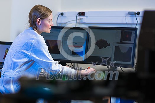 Female researcher carrying out research in a physics/chemistry lab (color toned image; shallow DOF) Female researcher carrying out research in a physics/chemistry lab (color toned image; shallow DOF)