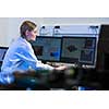 Female researcher carrying out research in a physics/chemistry lab (color toned image; shallow DOF)