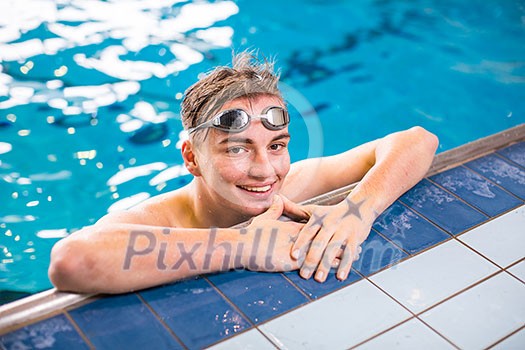 Male swimmer in an indoor swimming pool Male swimmer in an indoor swimming pool