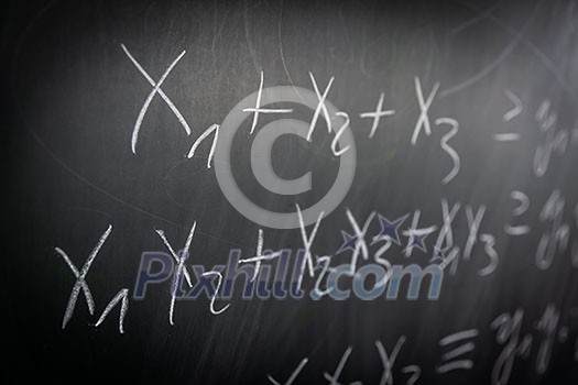 Blackboard with math lesson written on it Blackboard with math lesson written on it