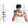 Young beautiful woman sitting at a desk in an office and working on blueprint