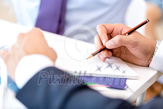 Close up hands writing. Office workplace Close up hands writing. Office workplace