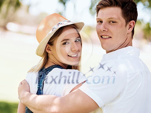 Romantic young couple relaxing in park Romantic young couple relaxing in park