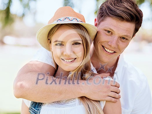 Romantic young couple relaxing in park Romantic young couple relaxing in park
