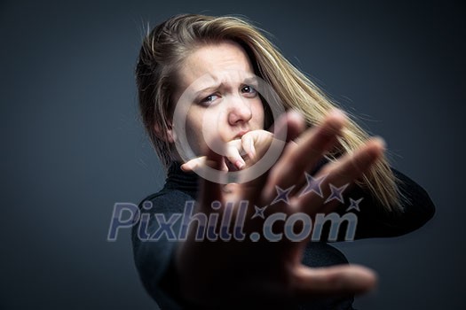 Young woman being a domestic violence victim Young woman being a domestic violence victim