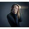 Young woman suffering from a severe stomach pain/depression/anxiety