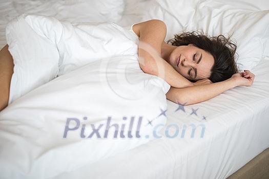 Beautiful young woman sleeping on bed at bedroom Beautiful young woman sleeping on bed at bedroom