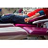 Young woman giving blood in a modern hospital