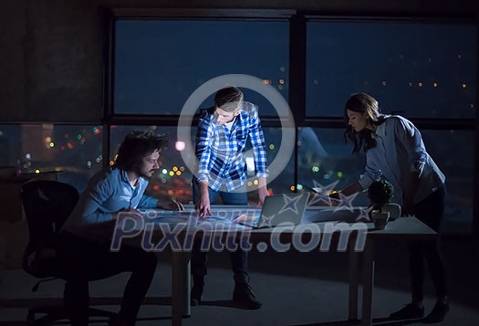 young team of business people in group, architect and engineer on construction site checking documents and business workflow using laptop computer in new startup office at night young team of business people in group, architect and engineer on construction site checking documents and business workflow using laptop computer in new startup office at night