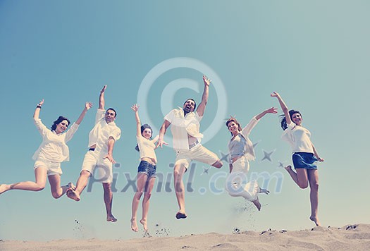 happy people group have fun run and jump on beach beautiful sand beach happy people group have fun run and jump on beach beautiful sand beach