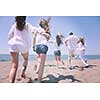 happy people group have fun  run and jump  on beach beautiful sand  beach