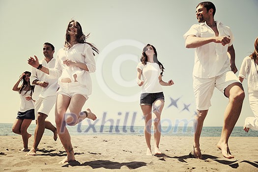 happy people group have fun run and jump on beach beautiful sand beach happy people group have fun run and jump on beach beautiful sand beach