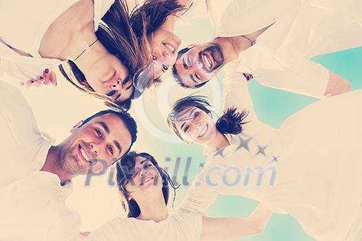 Group of happy young people in circle at beach have fun and smile Group of happy young people in circle at beach have fun and smile