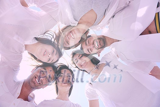 Group of happy young people in circle at beach have fun and smile Group of happy young people in circle at beach have fun and smile