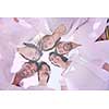 Group of happy young people in circle at beach  have fun and smile