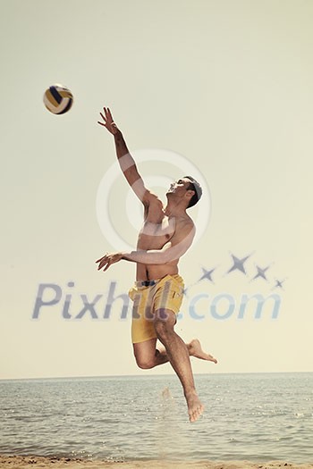 male beach volleyball game player jump on hot sand male beach volleyball game player jump on hot sand