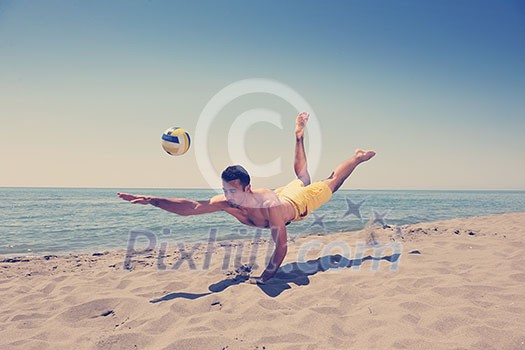 male beach volleyball game player jump on hot sand male beach volleyball game player jump on hot sand