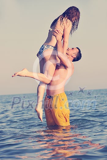 happy young couple have fun and romantic moments on beach at summer season and representing happynes and travel concept happy young couple have fun and romantic moments on beach at summer season and representing happynes and travel concept