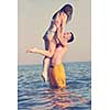 happy young couple have fun and romantic moments on beach at summer season and representing happynes and travel concept