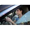 Pretty, young woman  driving a car -Invitation to travel. Car rental or vacation.