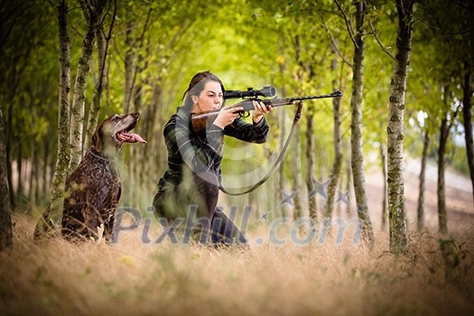 Autumn hunting season. Hunting. Outdoor sports. Woman hunter in the woods Autumn hunting season. Hunting. Outdoor sports. Woman hunter in the woods
