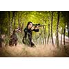 Autumn hunting season. Hunting. Outdoor sports. Woman hunter in the woods