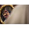Priest during a wedding ceremony/nuptial mass (shallow DOF; color toned image)