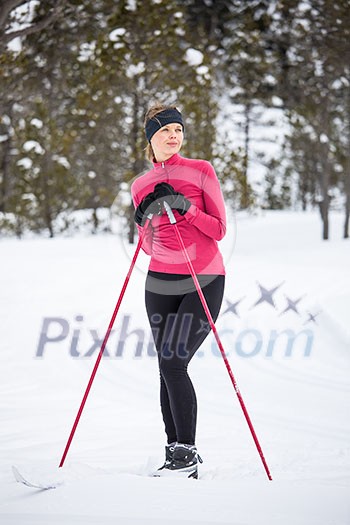 Cross-country skiing: young woman cross-country skiing on a winter day Cross-country skiing: young woman cross-country skiing on a winter day