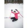 Cross-country skiing: young woman cross-country skiing on a winter day (motion blurred image)