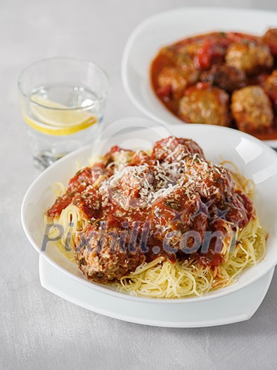 Delicious homemade meat balls in tomato sauce with spaghetti Delicious homemade meat balls in tomato sauce with spaghetti