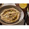 Delicious hummus with pine nuts and olive oil.