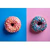 Colorful tasty glazed donuts on a colored background.